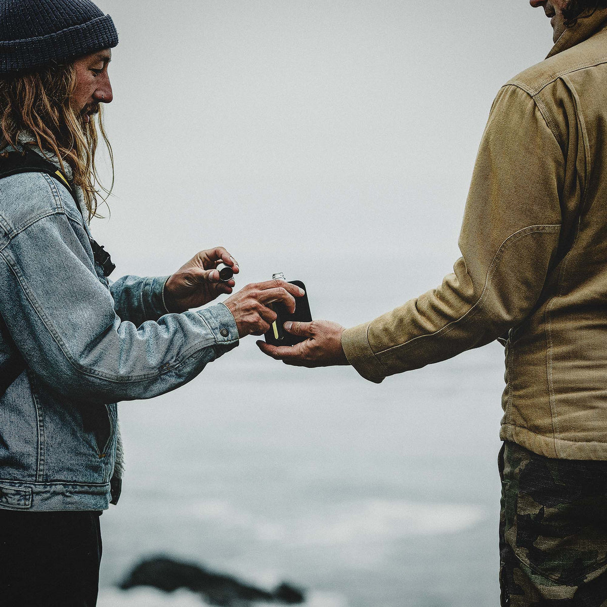 Black Silicone Glass Flask Single Shot 100mL sharing lifestyle shot 